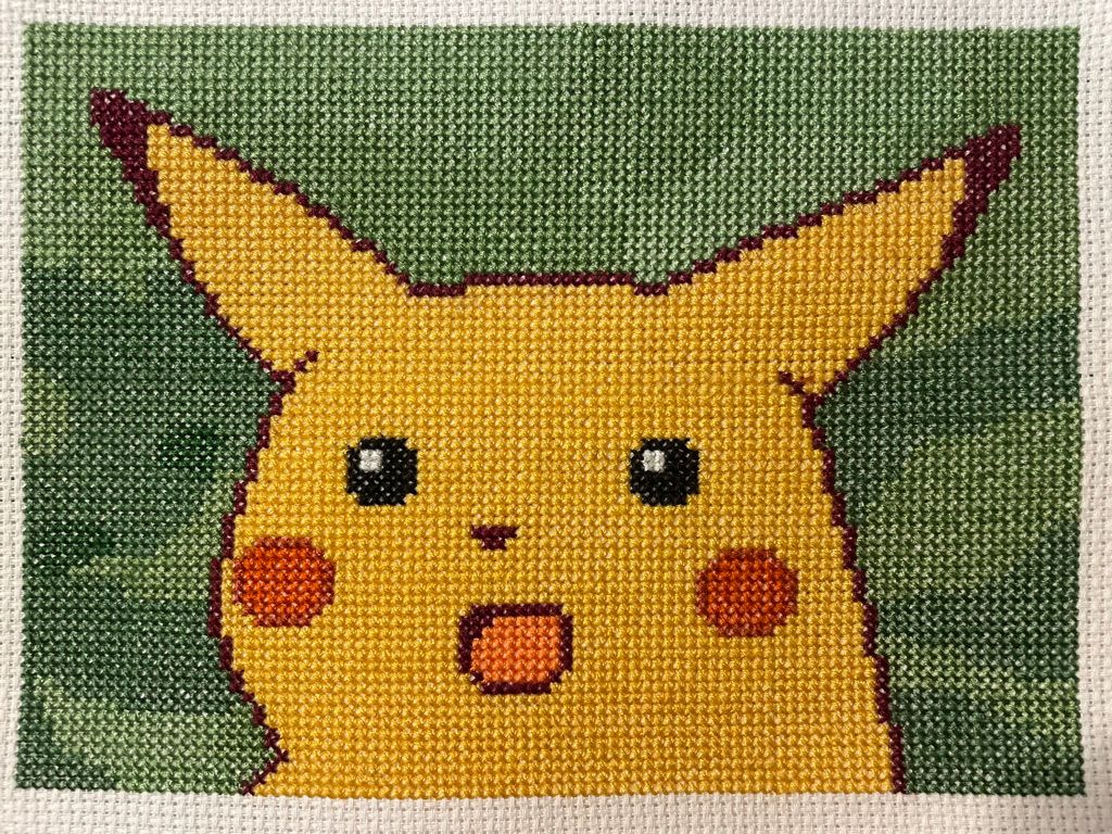 A shocked Pikachu, done in cross-stitch.