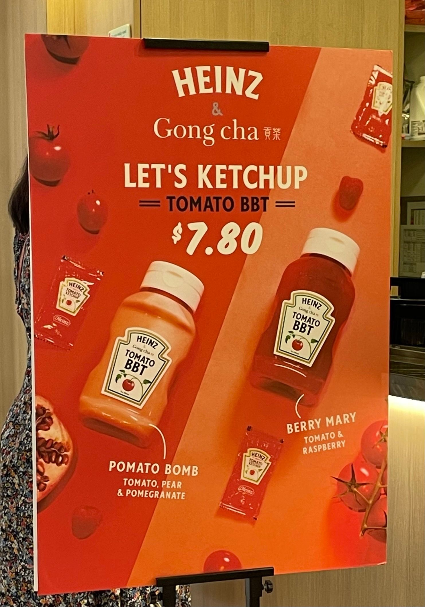 A red poster advertising a tie-up between Gong Cha and Heinz. They are offering two flavours of tomato bubble tea.