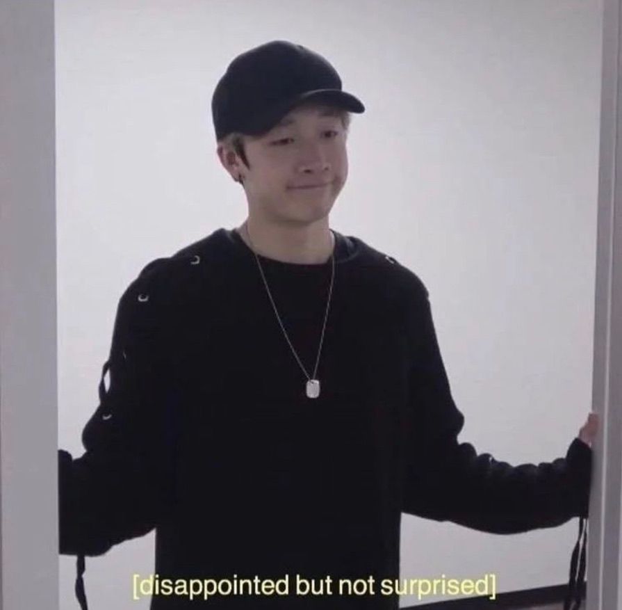 A meme of K-pop idol Bang Chan looking resigned, with a caption that reads "disappointed but not surprised".
